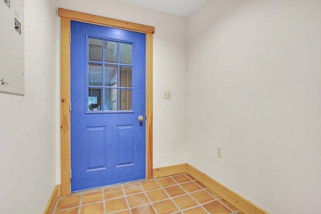 doorway with tile patterned floors