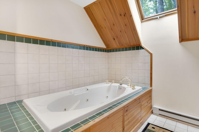 bathroom featuring baseboard heating, tile patterned flooring, tiled bath, lofted ceiling with skylight, and tile walls