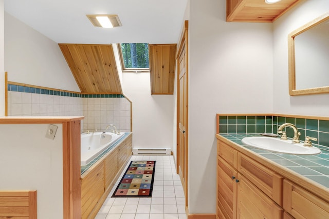 bathroom featuring a bathtub, vanity, lofted ceiling, tile patterned floors, and a baseboard radiator