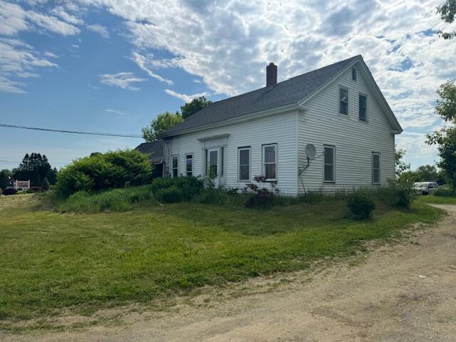 view of home's exterior featuring a yard