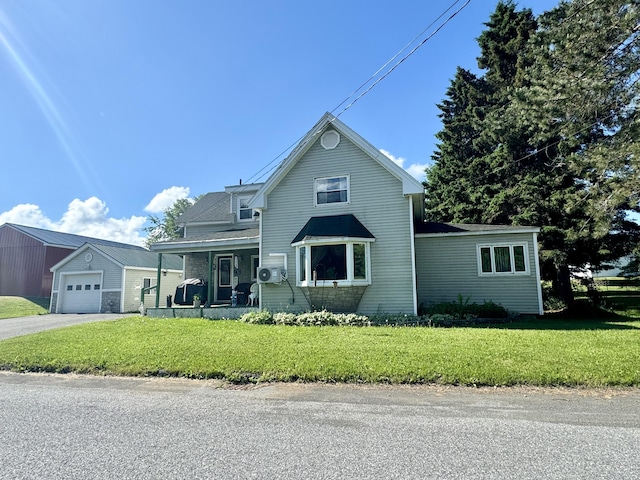 front of property featuring a garage, a front yard, and covered porch