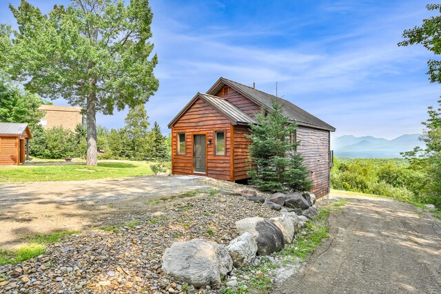 log-style house with a mountain view