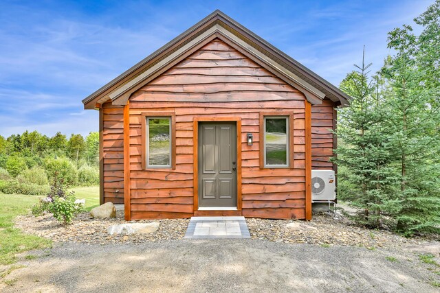 view of front of house with an outbuilding