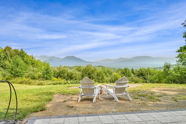 view of patio / terrace featuring a mountain view