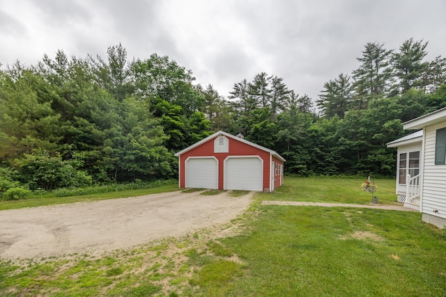 garage featuring a lawn