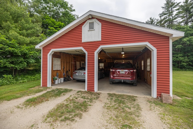 garage featuring a yard