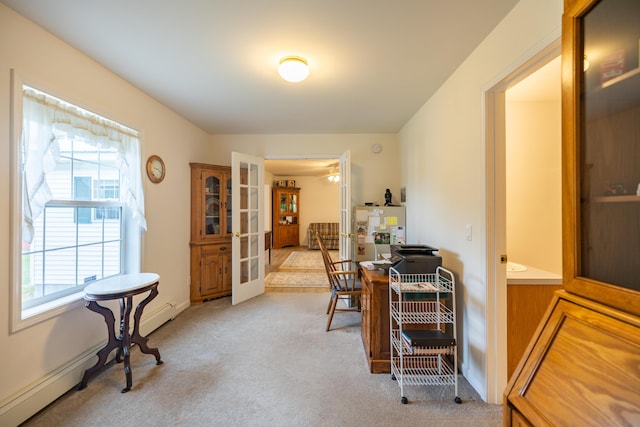 office area with light carpet, a wealth of natural light, and french doors