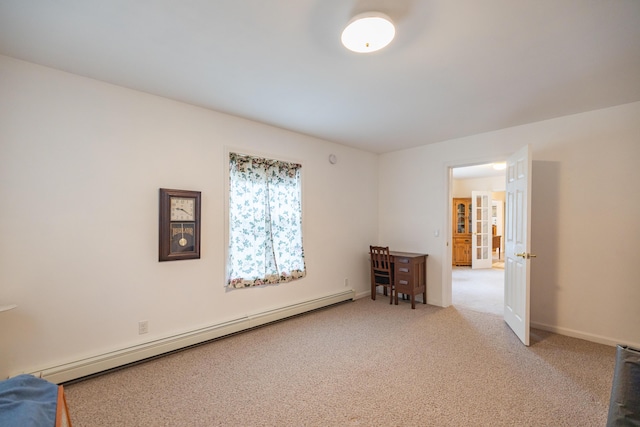 carpeted empty room with a baseboard radiator