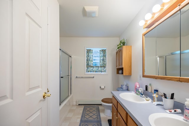 full bathroom with enclosed tub / shower combo, vanity, a baseboard radiator, and toilet