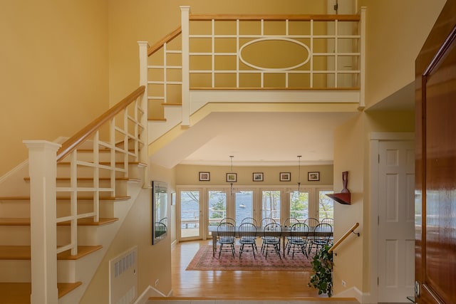 dining space featuring hardwood / wood-style flooring and crown molding