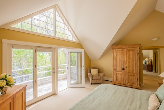 carpeted bedroom with vaulted ceiling, access to exterior, and multiple windows