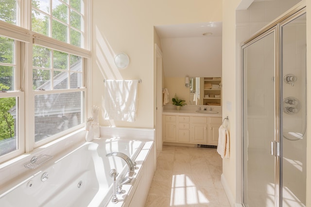 bathroom featuring shower with separate bathtub, vanity, tile patterned floors, and a healthy amount of sunlight