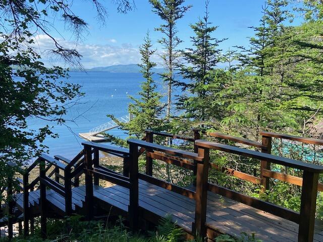 deck featuring a water and mountain view
