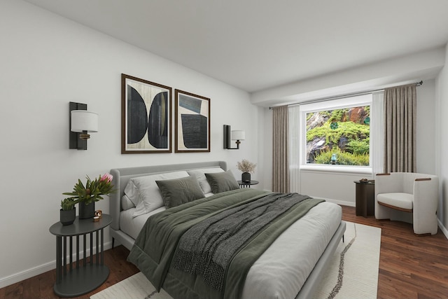 bedroom with baseboards and wood finished floors