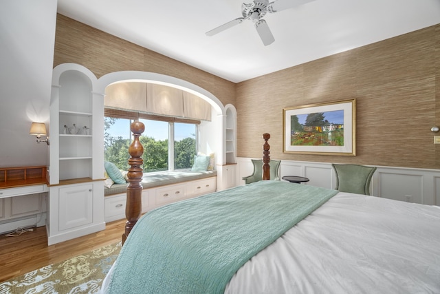 bedroom with ceiling fan and light hardwood / wood-style floors