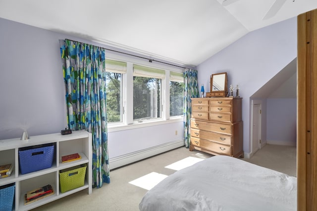 bedroom with baseboard heating, light colored carpet, and lofted ceiling