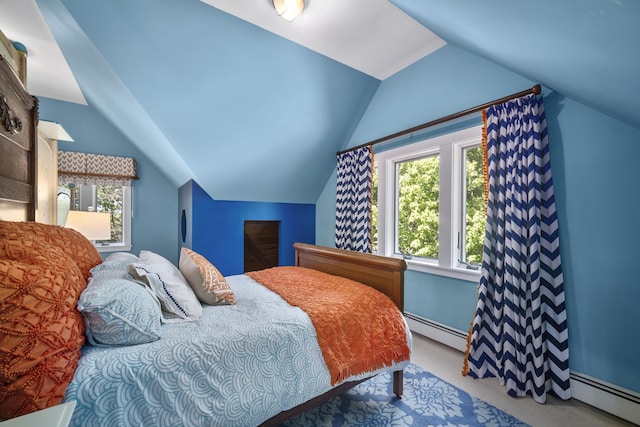 carpeted bedroom with lofted ceiling and a baseboard heating unit