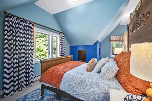 bedroom with carpet floors, vaulted ceiling, and a baseboard heating unit