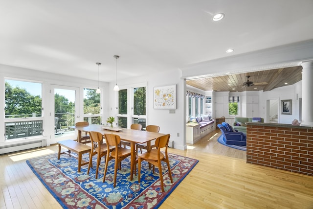 dining area with light hardwood / wood-style floors, baseboard heating, ceiling fan, and wooden ceiling