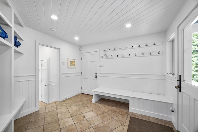 mudroom with plenty of natural light and wood ceiling