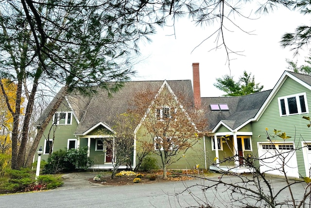 view of front of house with covered porch and a garage