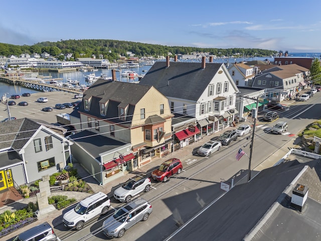 birds eye view of property featuring a water view