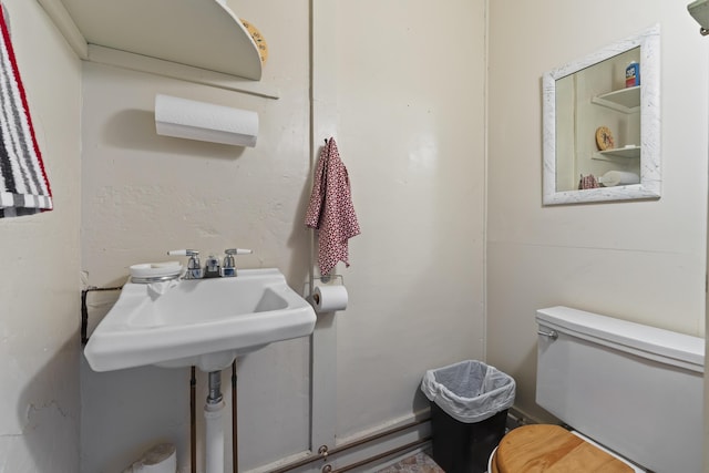 bathroom featuring sink and toilet