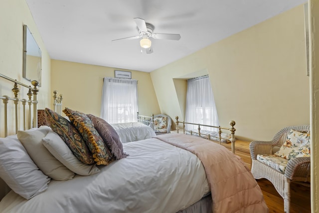 bedroom with ceiling fan and hardwood / wood-style floors