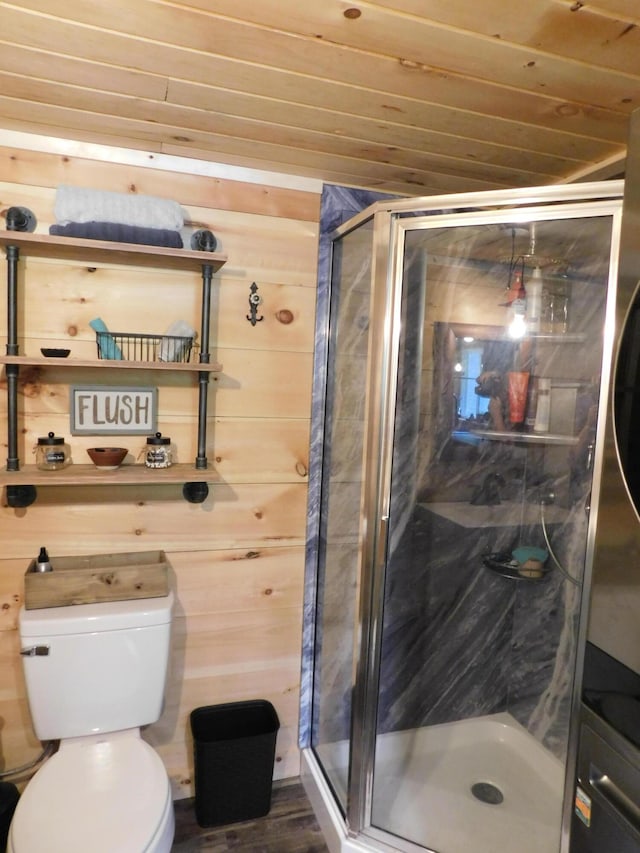 bathroom with wooden ceiling, toilet, and wooden walls