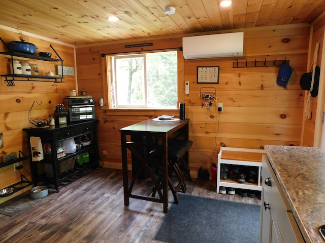 home office with wooden walls, dark wood-type flooring, an AC wall unit, and wooden ceiling