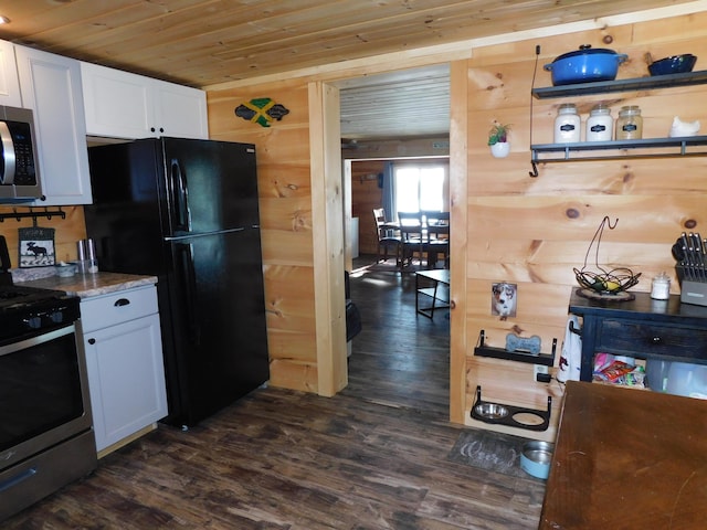 kitchen with dark wood-type flooring, stainless steel appliances, wood ceiling, and white cabinetry