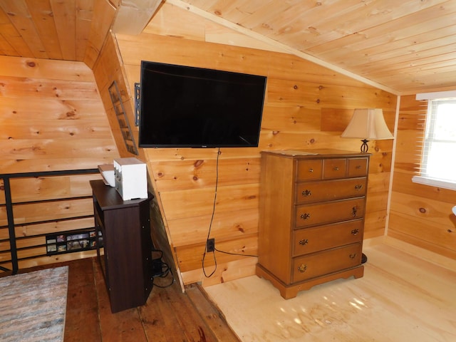 bedroom with wooden ceiling, hardwood / wood-style floors, lofted ceiling, and wood walls