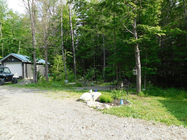 view of yard with a garage