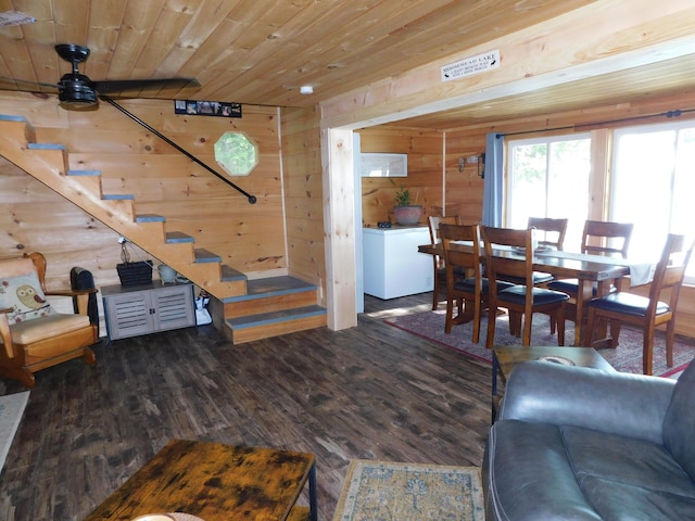 living room featuring wood walls, wooden ceiling, ceiling fan, log walls, and wood-type flooring