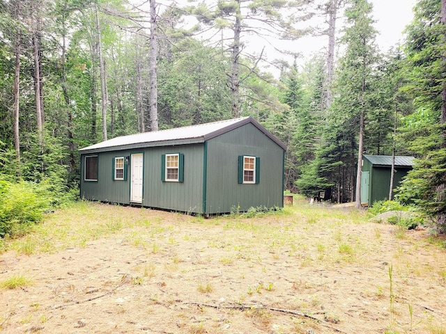 2 Emery Farm Rd, Medford, ME 04463 - view of outdoor structure featuring a forest view and an outbuilding