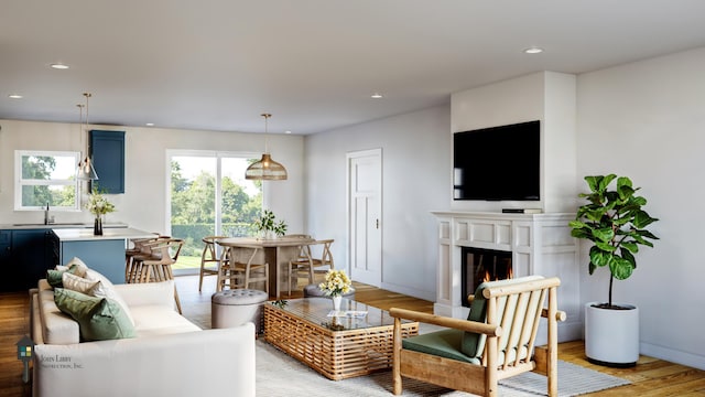 living room with sink and light hardwood / wood-style flooring