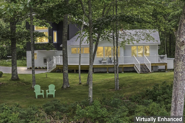 back of house featuring a yard and a deck