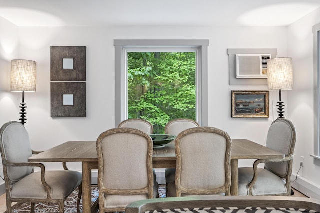 dining room with a wall unit AC