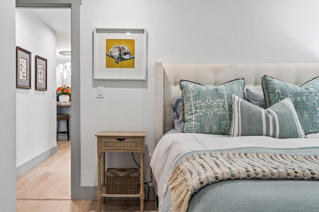 bedroom with hardwood / wood-style floors