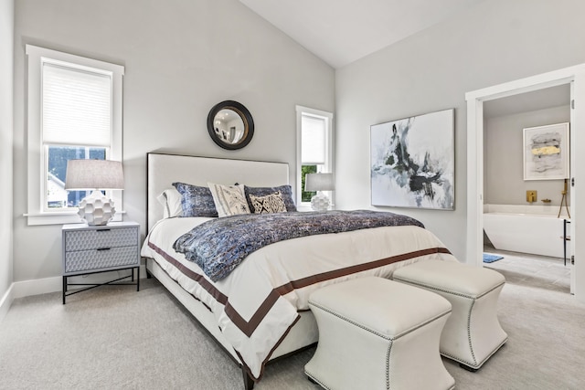 carpeted bedroom with vaulted ceiling