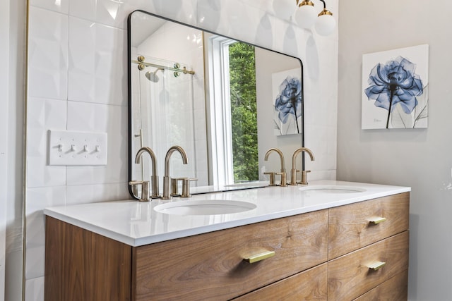 bathroom featuring vanity, tile walls, and an enclosed shower