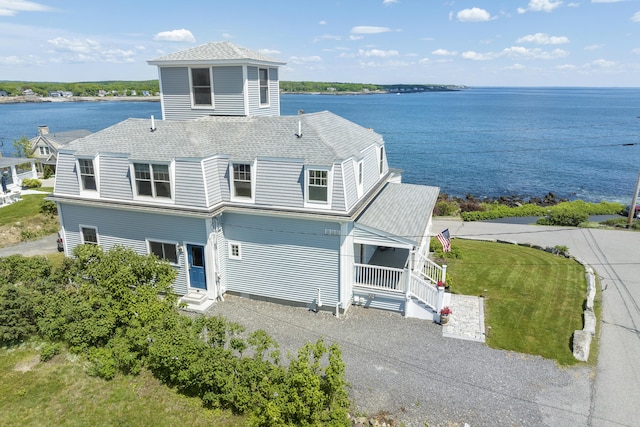 exterior space with a water view