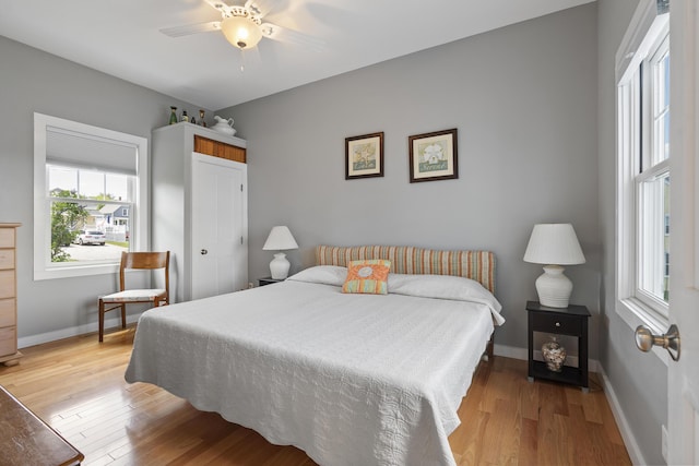 bedroom featuring light hardwood / wood-style floors and ceiling fan