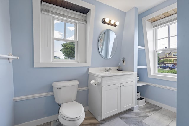 bathroom with vanity and toilet