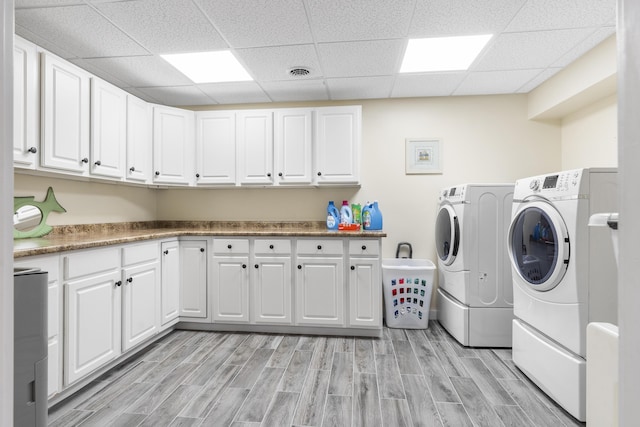 laundry room with cabinets and independent washer and dryer