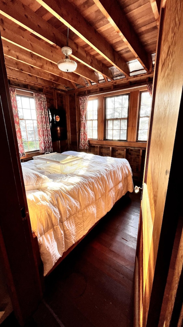 677 Friendship Long Is, Friendship, ME 04547 - unfurnished bedroom with wooden ceiling, dark hardwood / wood-style floors, beamed ceiling, and wooden walls