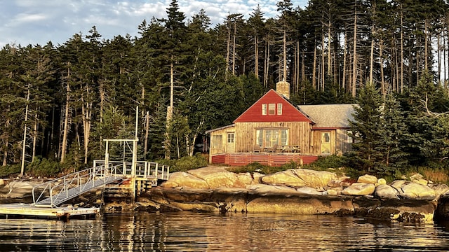 back of house with a water view