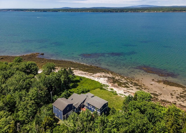 bird's eye view featuring a water view and a beach view