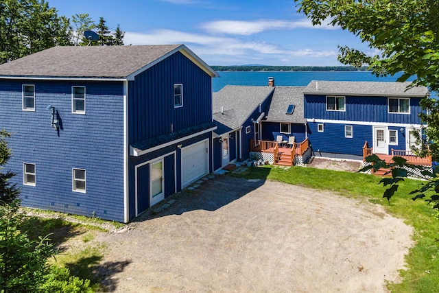 exterior space with a water view