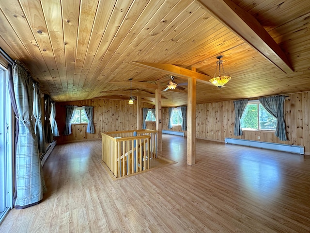 additional living space with hardwood / wood-style flooring, baseboard heating, wood ceiling, and vaulted ceiling with beams